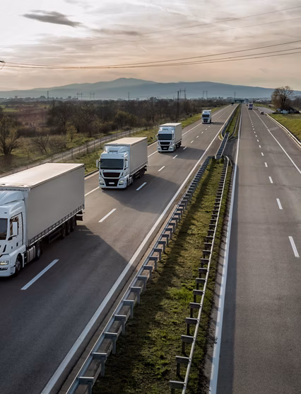 Caravan or convoy of trucks in line on a country highway