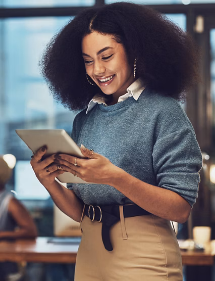 Business, tablet and night with woman in office for technology, happy and communication. Social media, connection and internet with female and search online for networking, email and website.