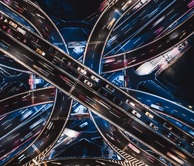 Aerial View of Overpass and City Traffic at Night / Shanghai, China