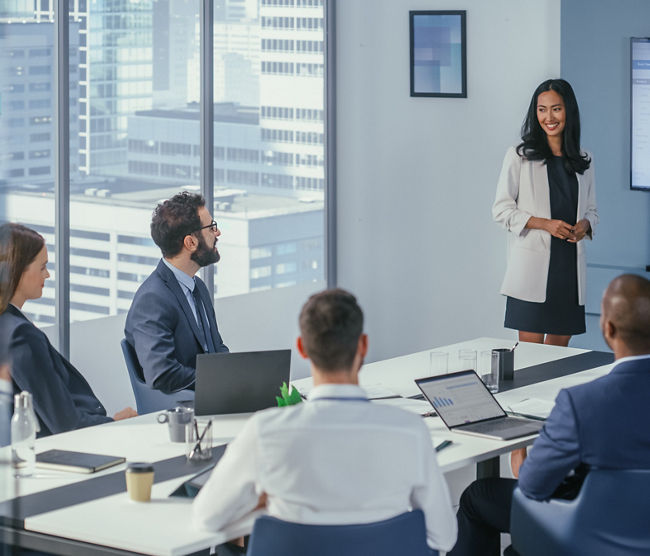 Diverse Office Conference Room Meeting: Asian Female Project Manager Presents Digital Business Expansion Strategy for Investment Team, Uses Wall TV with Big Data Analysis, e-Commerce Infographics.
