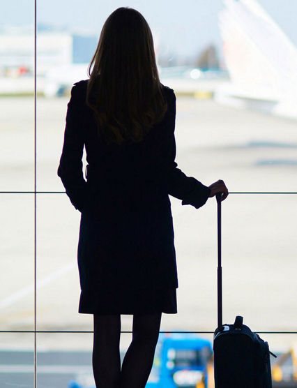 woman looking at a plane