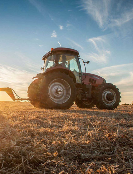 tractor with a  sunset background