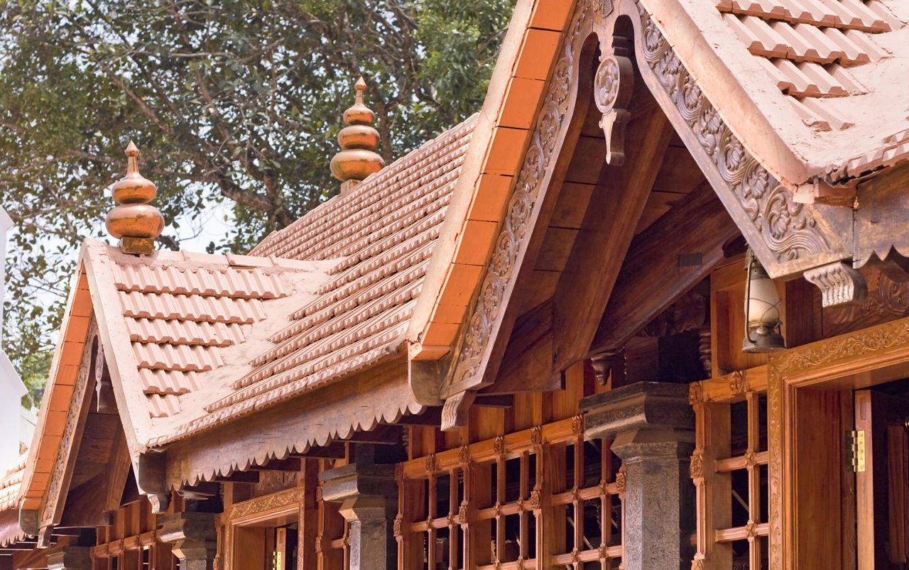 Kerala home with terracotta roof tiles