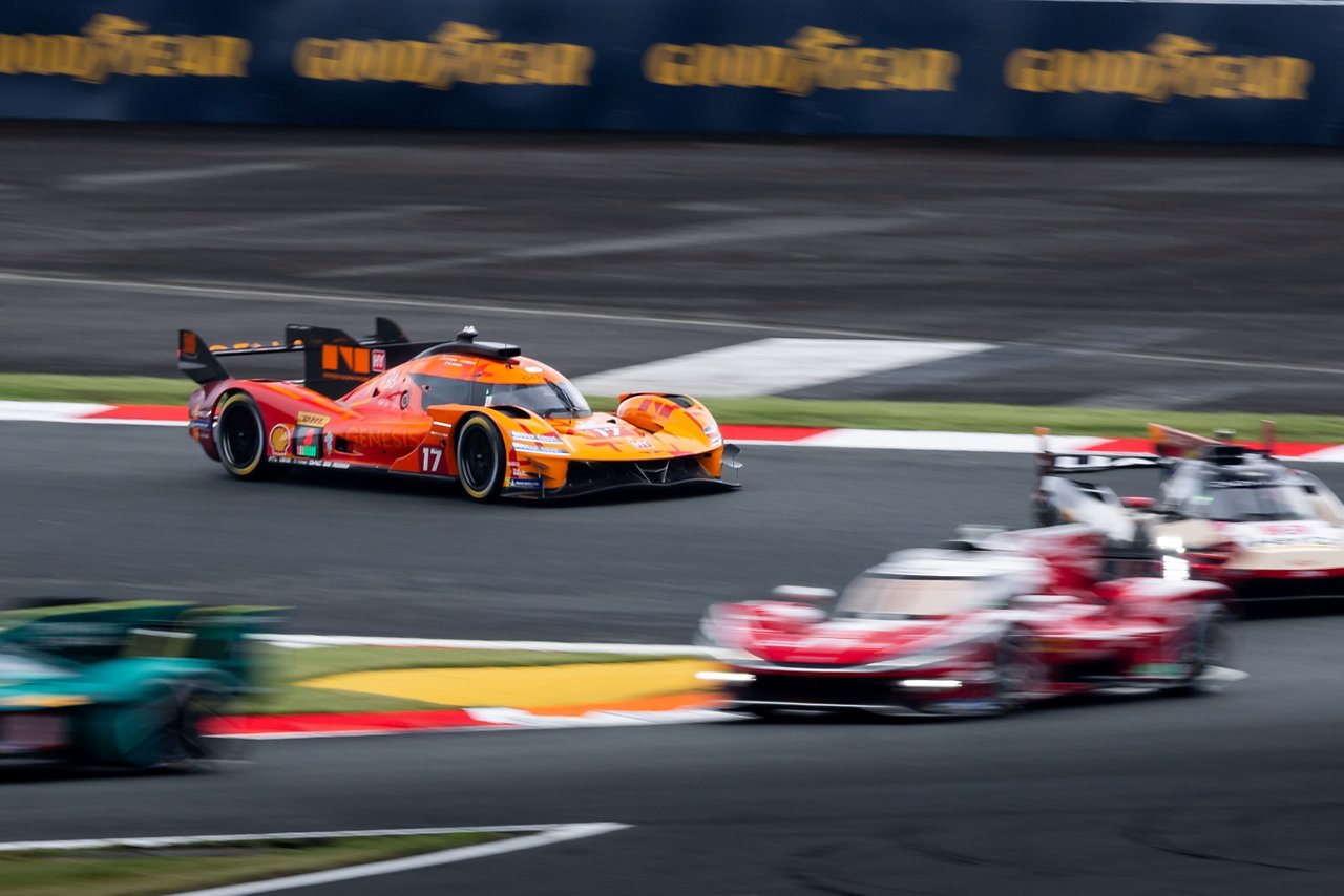 GMR-001 Hypercar battling through traffic during the WEC Fuji race.