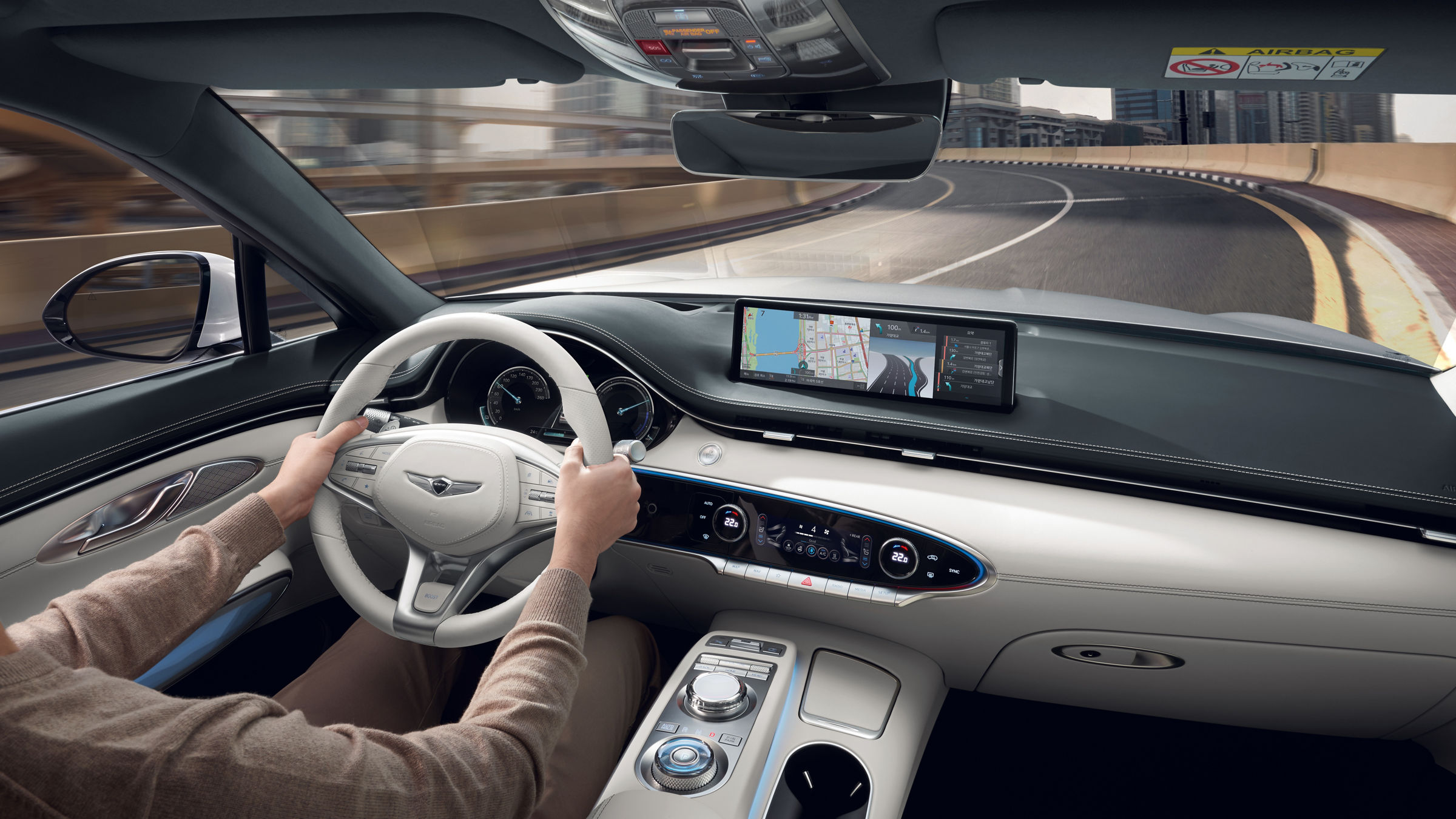 Interior of a car with a person at the wheel