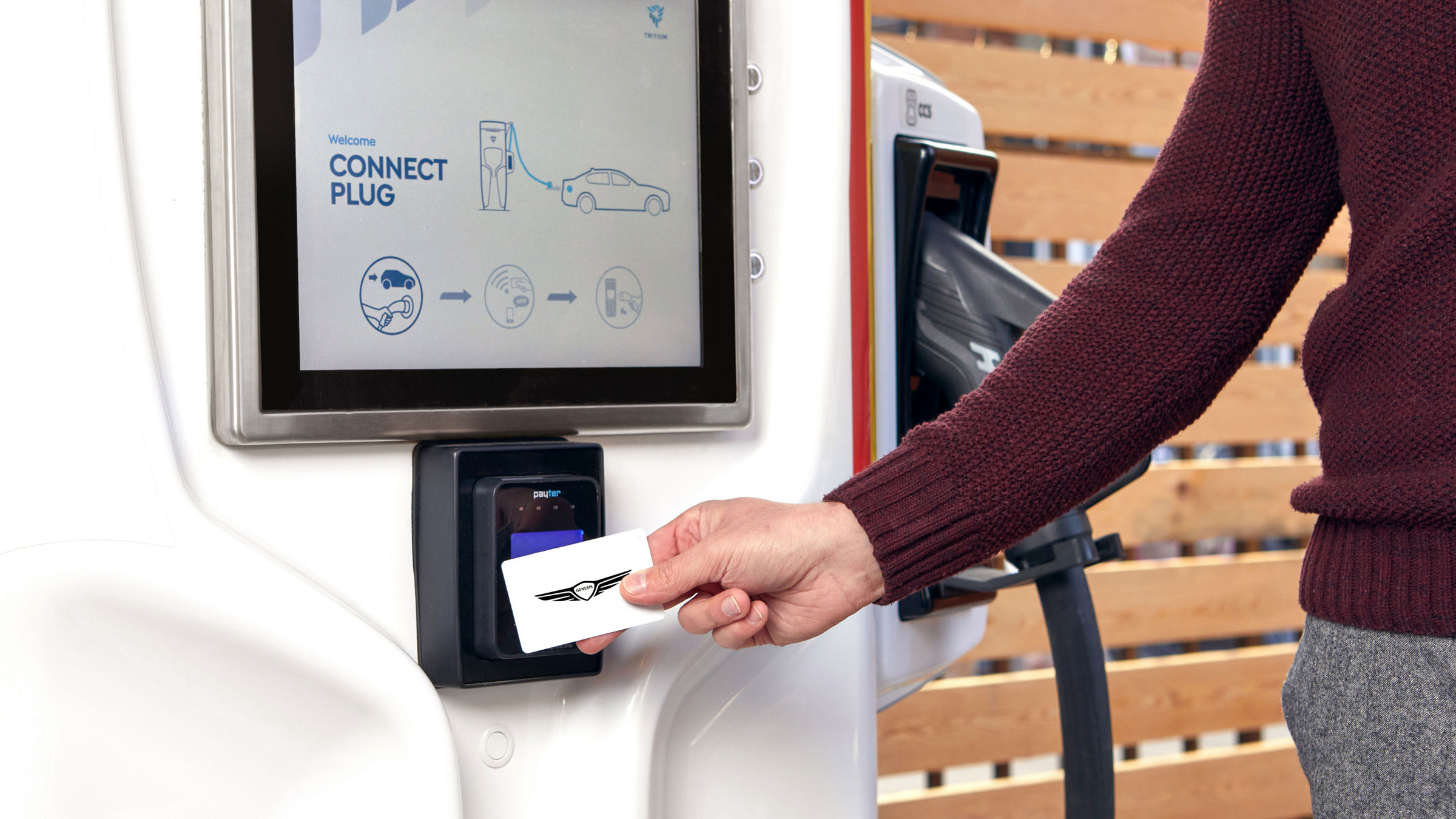 Person with card at a charging station