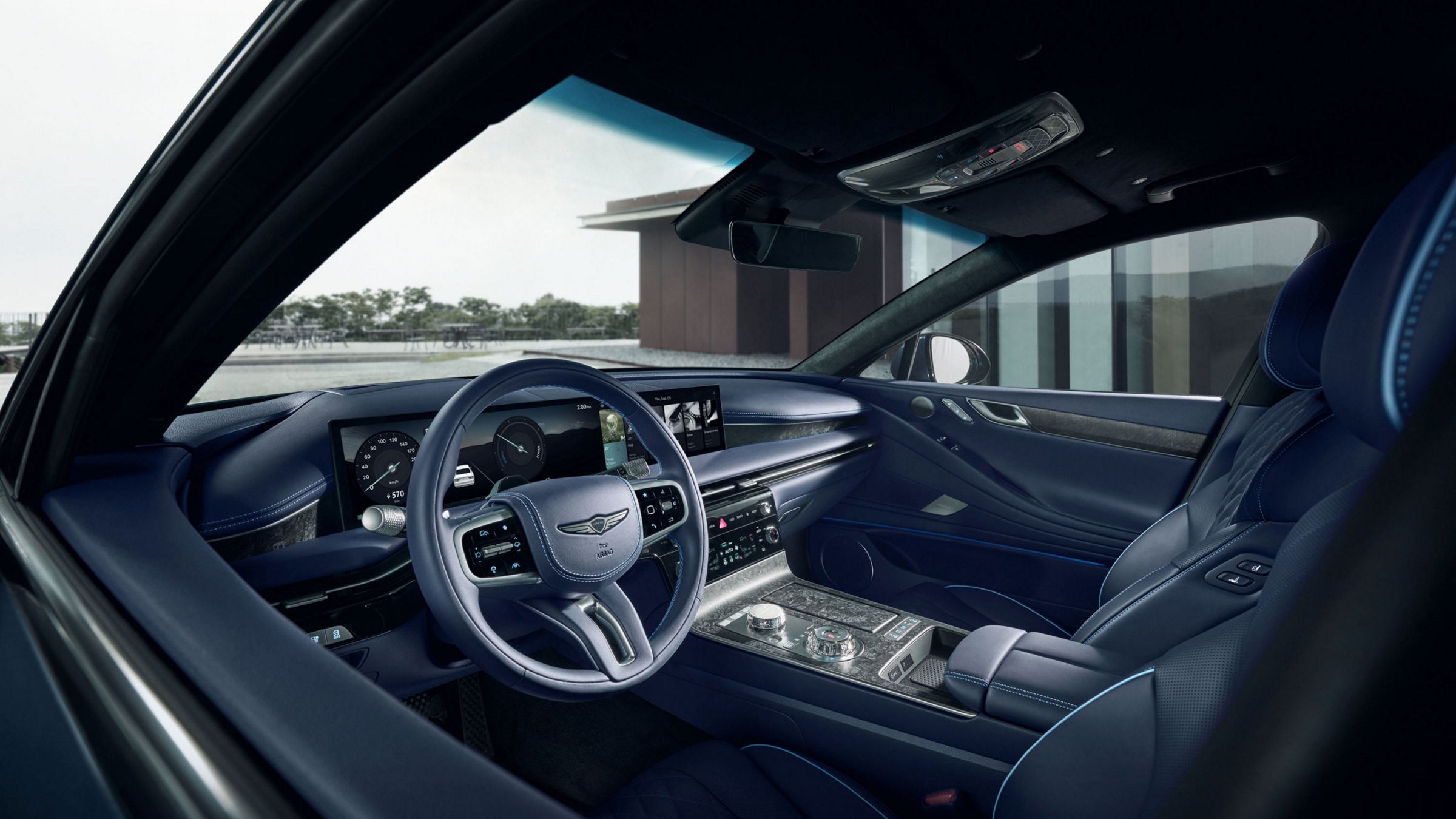 Detail of the luxury sedan Electrified G80's interior showcasing the premium Forged Wood Black trim and dashboard design.