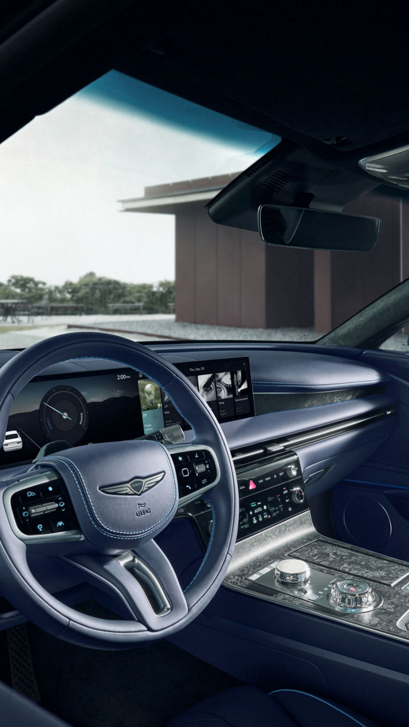 Detail of the luxury sedan Electrified G80's interior showcasing the premium Forged Wood Black trim and dashboard design.