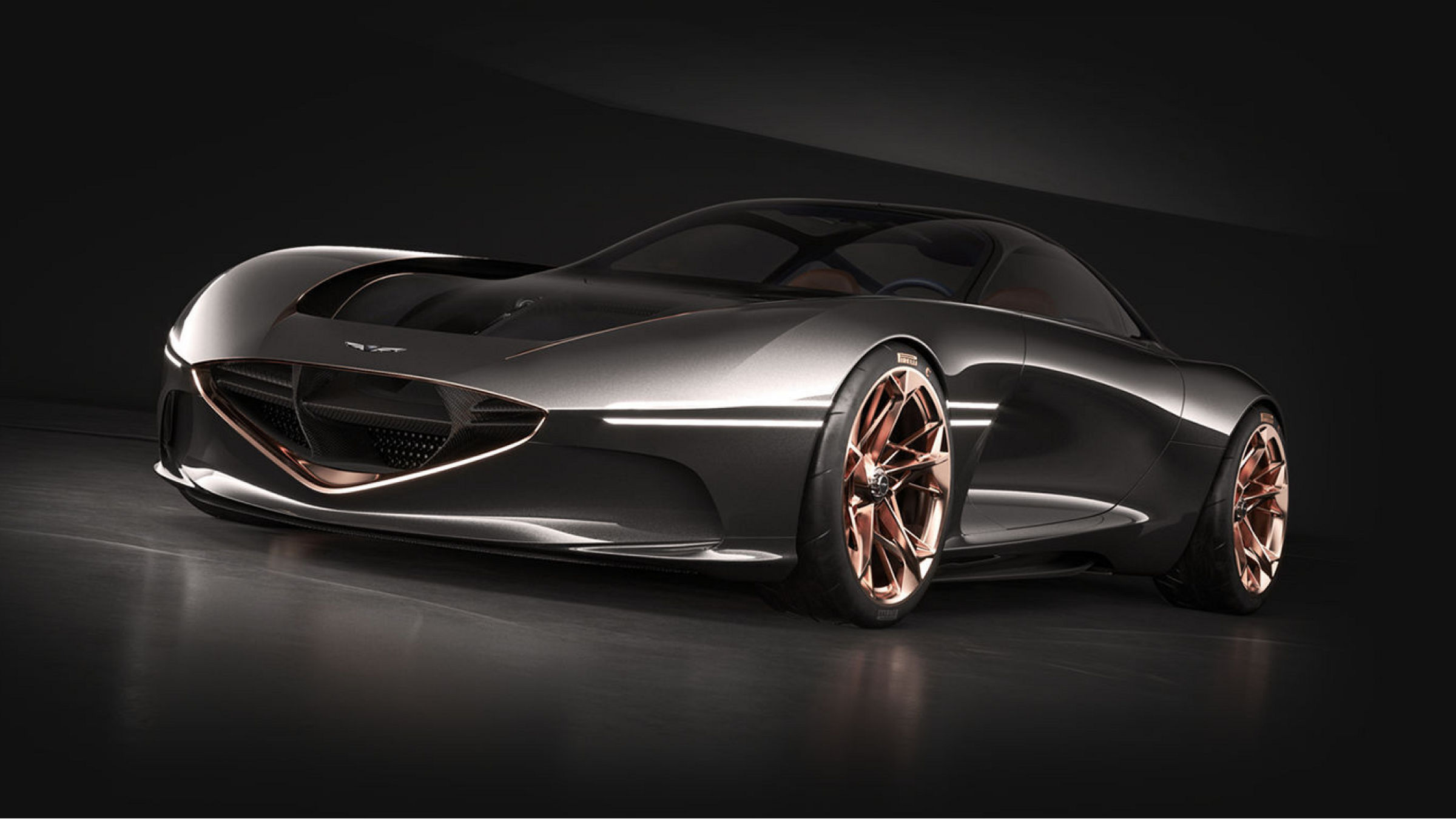 Genesis Essentia Concept car in a sleek metallic finish with copper-colored wheels, front-side view