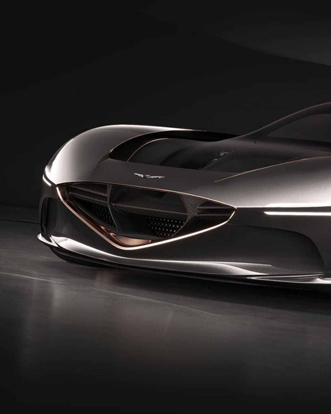 Genesis Essentia Concept car in a sleek metallic finish with copper-colored wheels, front-side view