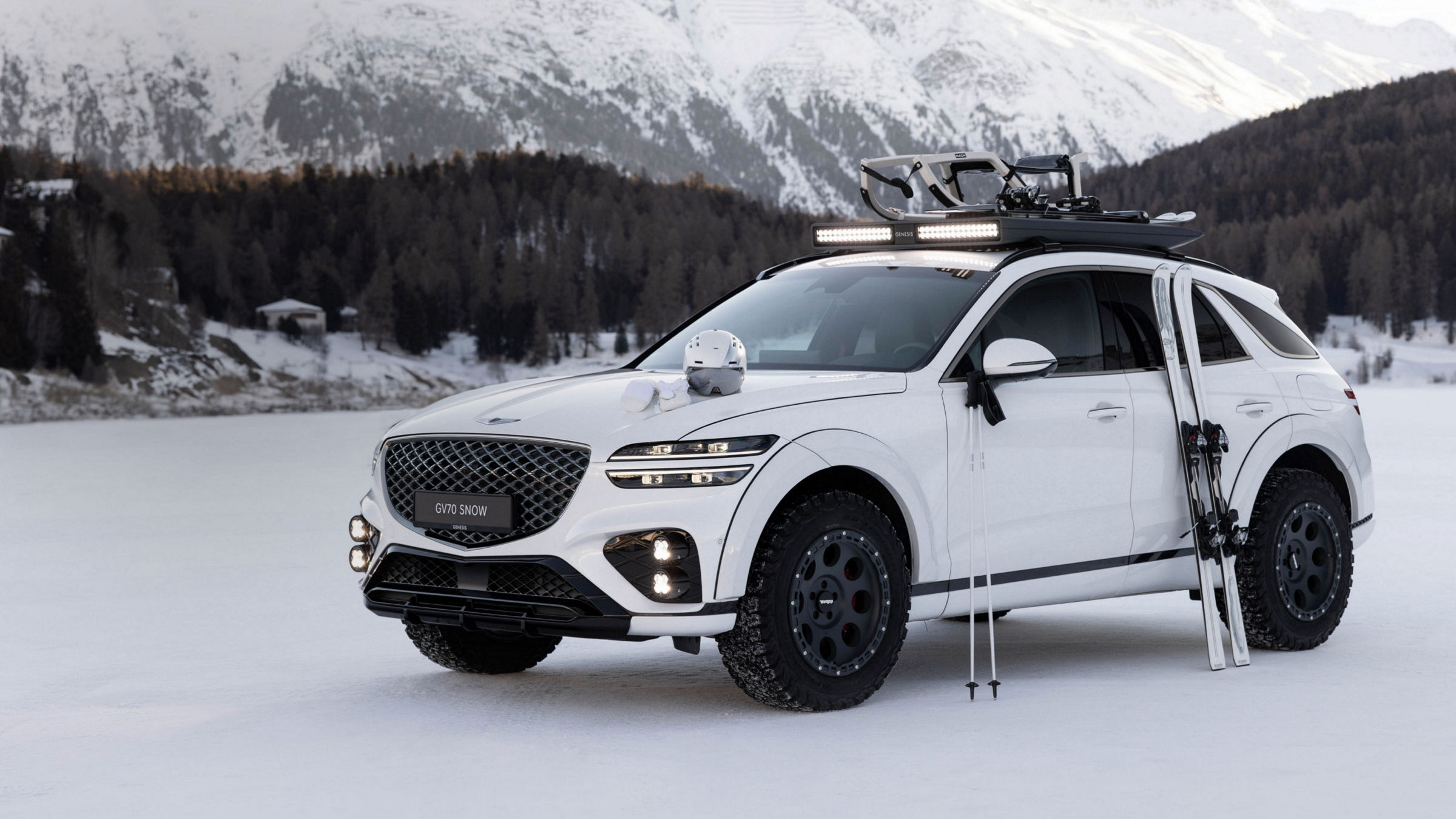 Genesis X Snow Speedium Concept with ski equipment on a snowy mountain landscape