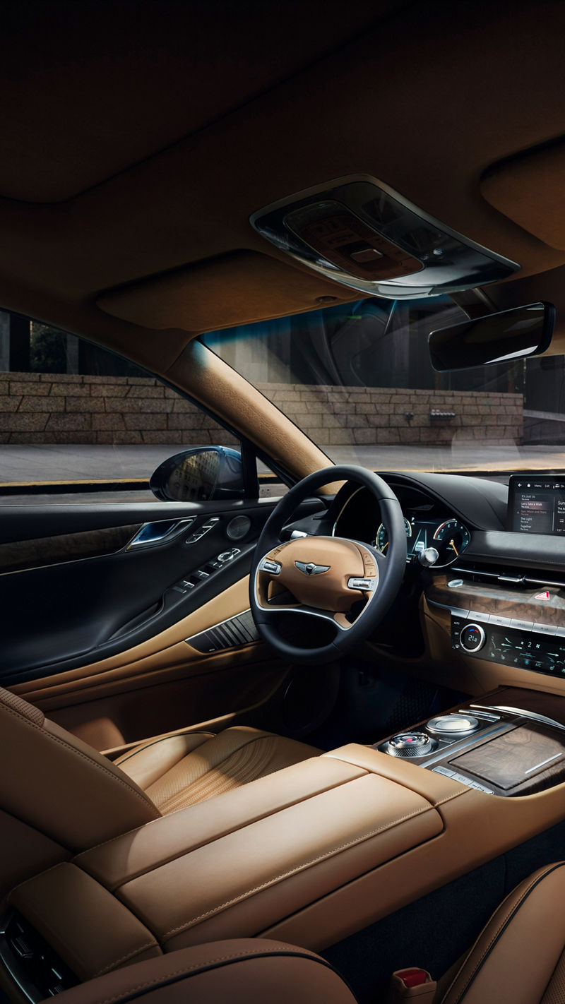 Genesis G80 front interior with brown-black dashboard