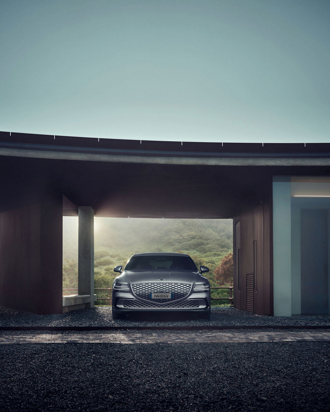 Exterior view of the Genesis Electrified G80 luxury electric sedan showcasing its design and distinctive lighting.