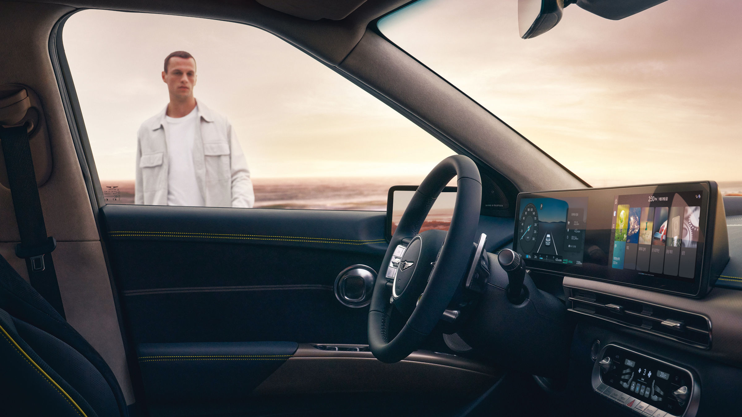 Man looks through the window at the driver's seat of the Genesis GV60