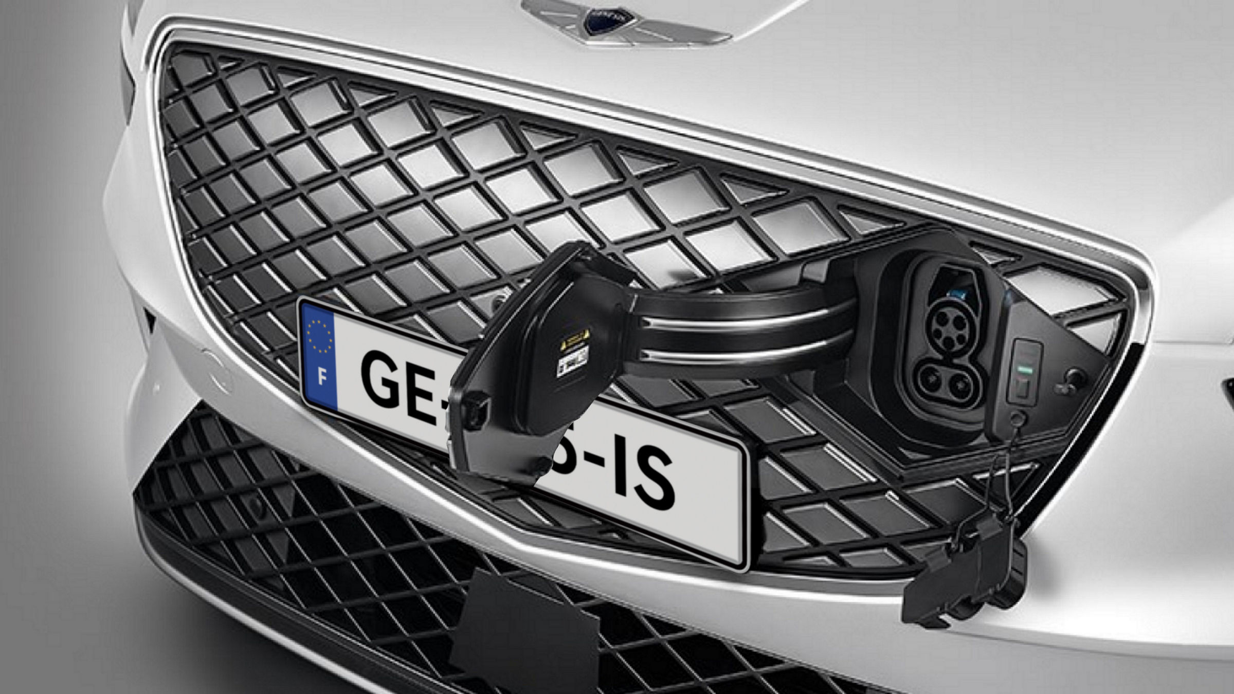 The charger is inserted into the G-Matrix Patterned Grille’s Hidden Charging Door of Genesis Electrified GV70.
