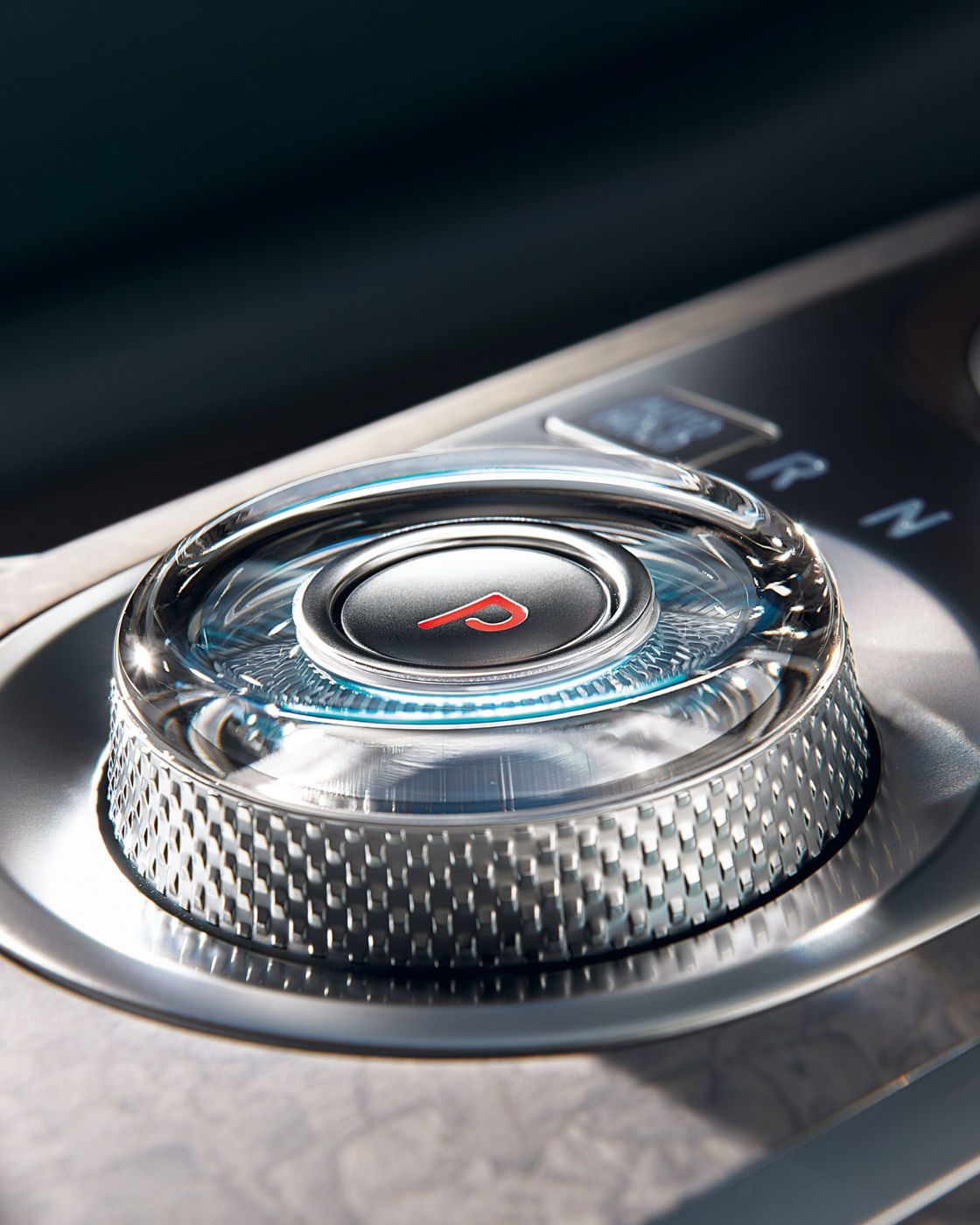 Close-up of the crystal rotary gear selector in the Electrified Genesis G80 luxury sedan.