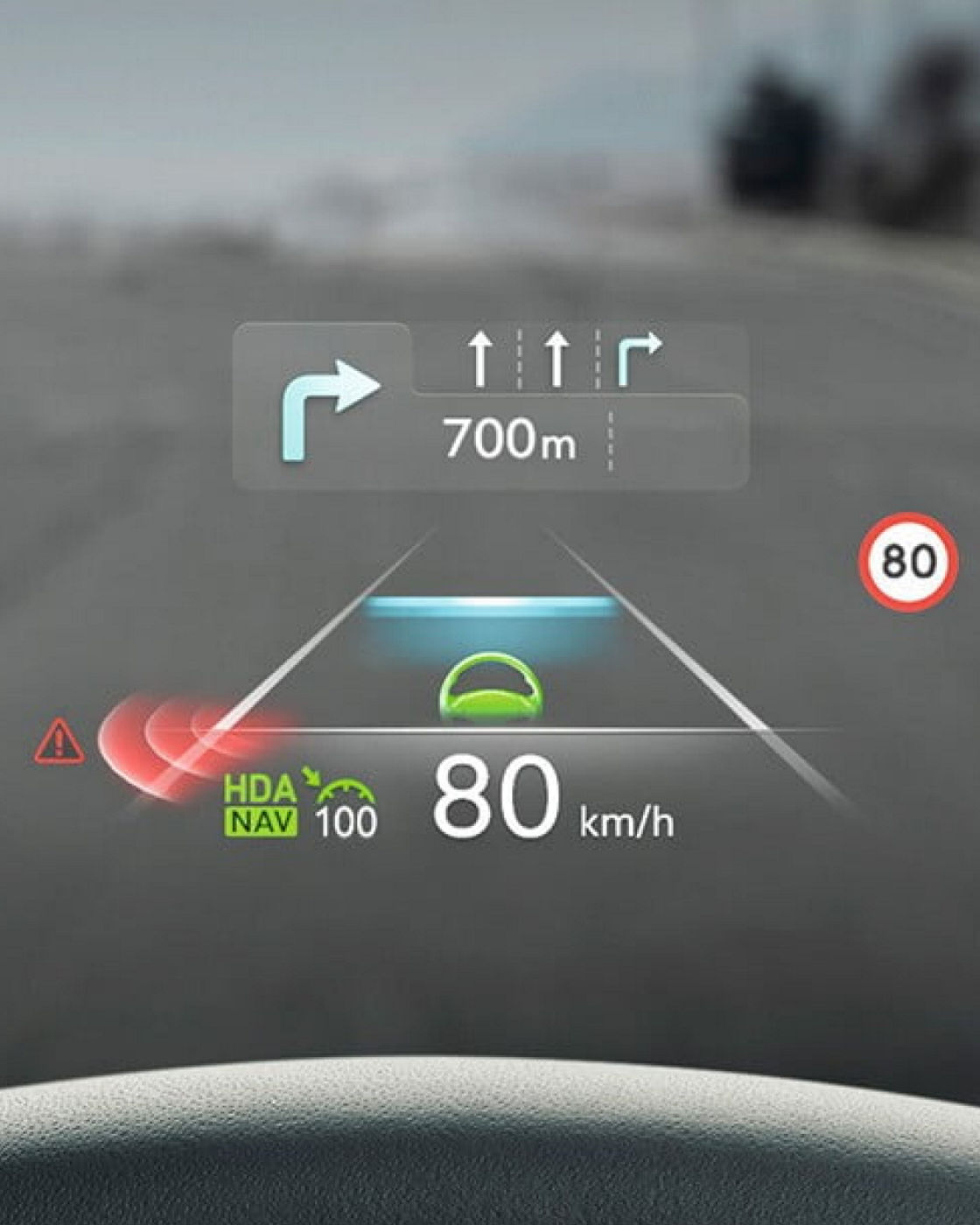 A heads-up display (HUD) in the Electrified G80 showing navigation instructions, speed, and safety alerts on the windshield.