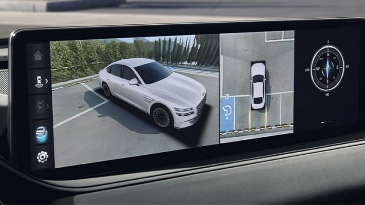 A touchscreen in the Electrified G80 displaying a 360-degree camera view for parking assistance.