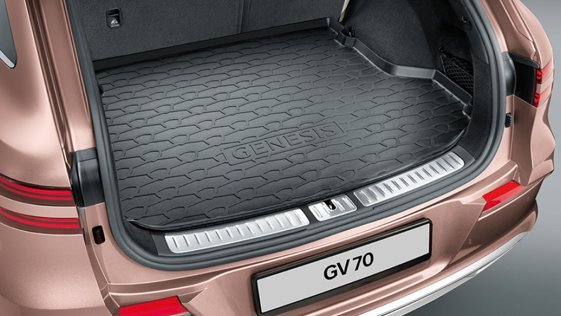 The cargo area of an Electrified Genesis GV70 with a durable rubber mat, designed for protection and practicality.