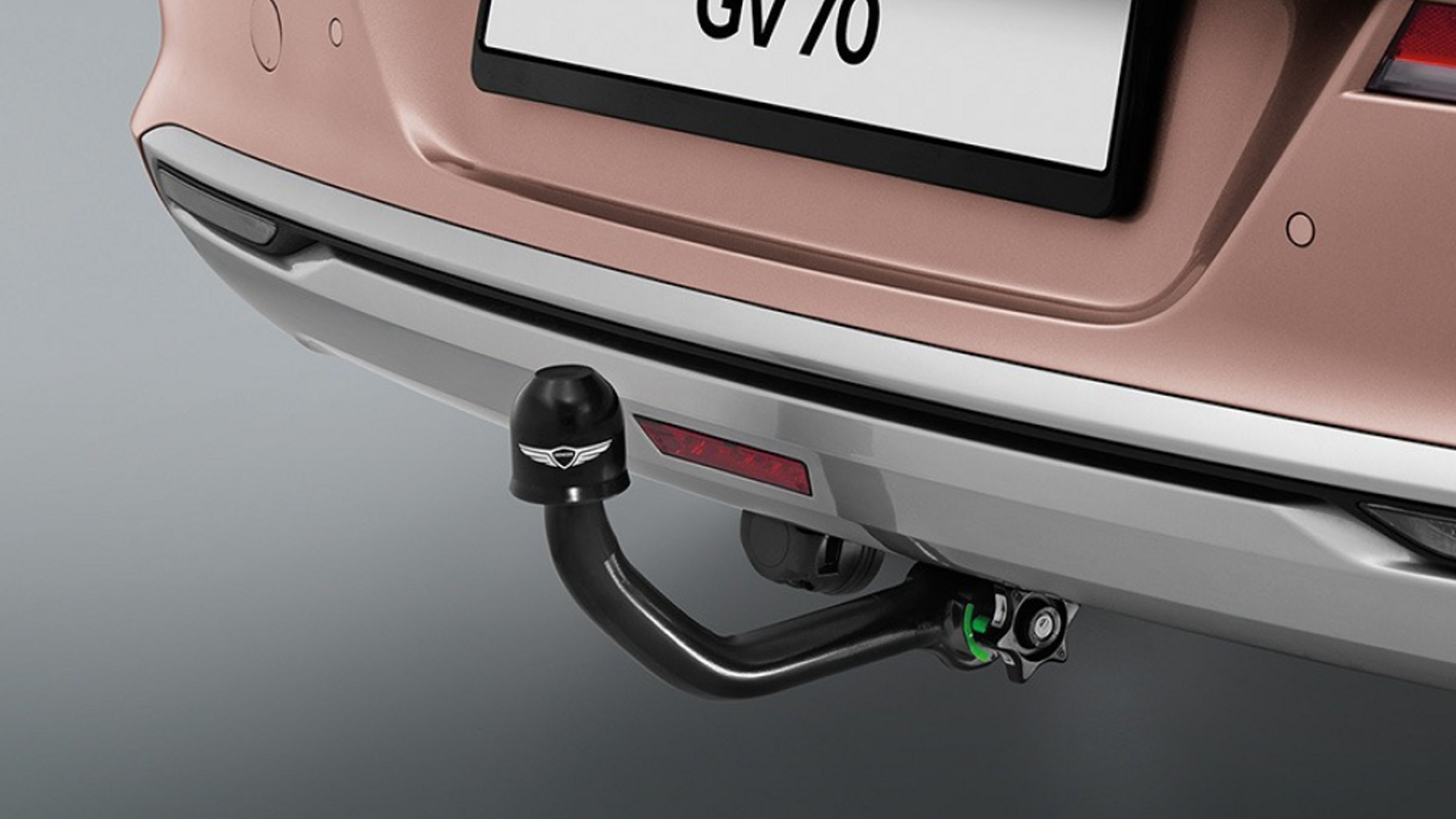 A close-up of the Electrified Genesis GV70's tow hitch, designed for versatility and utility.