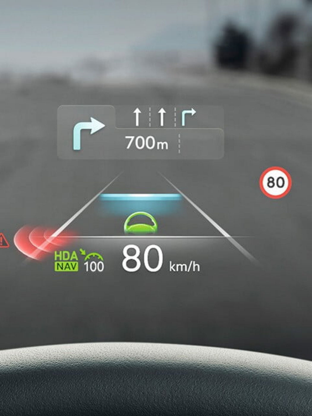 A digital heads-up display showing navigation directions, speed limit, and vehicle speed on a Genesis windshield.