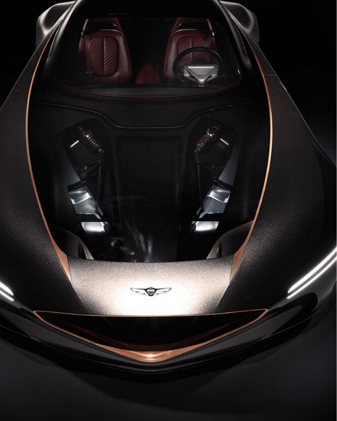 Top view of the Genesis Essentia showing the transparent hood and luxurious interior.