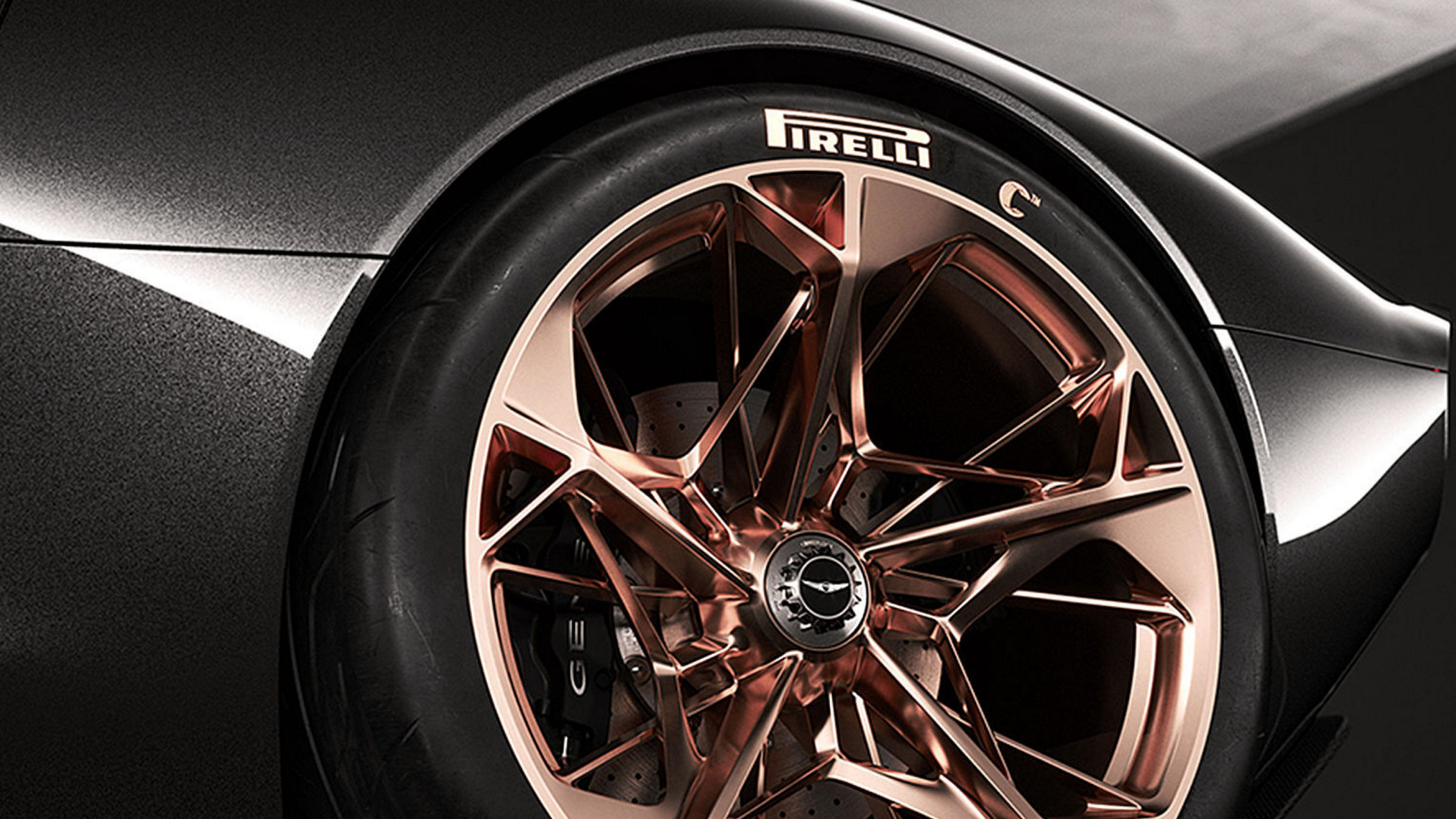 Close-up of copper alloy Pirelli wheel on Genesis Essentia.