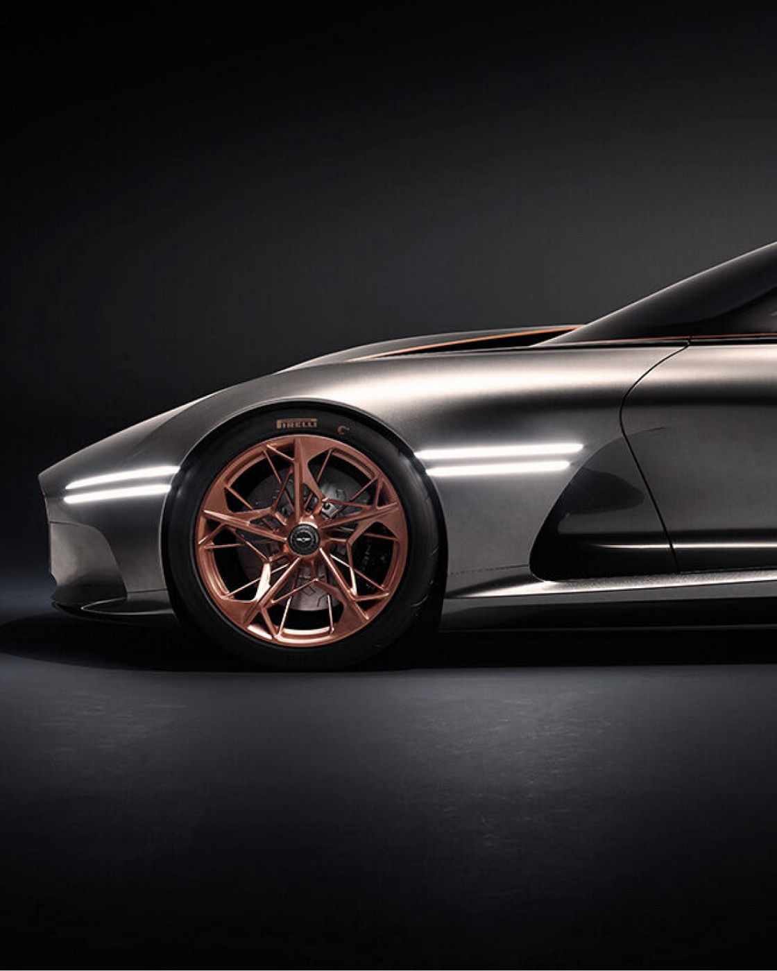 Close-up of the Genesis Essentia's copper alloy wheel and aerodynamic body.