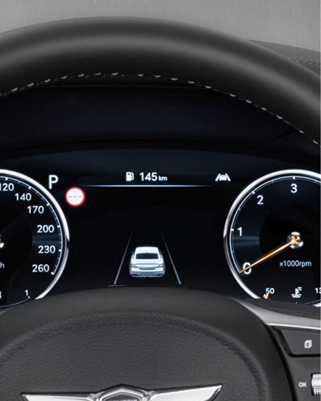 Close-up of the G70 Shooting Brake's digital dashboard, displaying vehicle speed and driver assistance information.