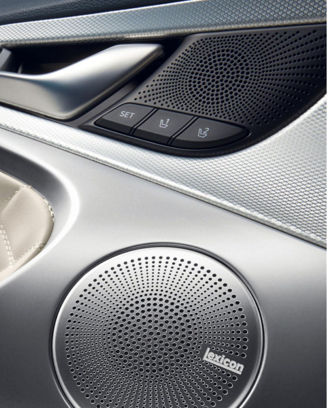 Close-up of the Genesis G70's Lexicon speaker and door panel.