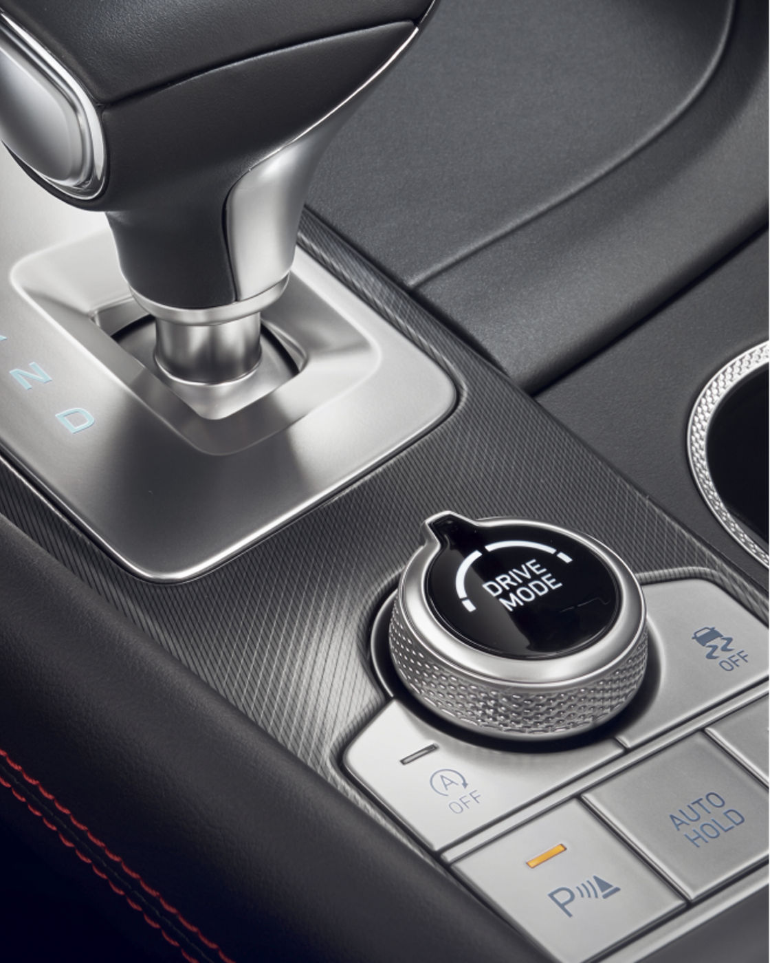 Close-up of the Genesis G70's gear shifter and drive mode selector.