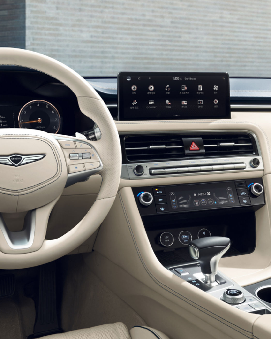 Close-up of the Genesis G70's beige interior with a detailed view of the dashboard.