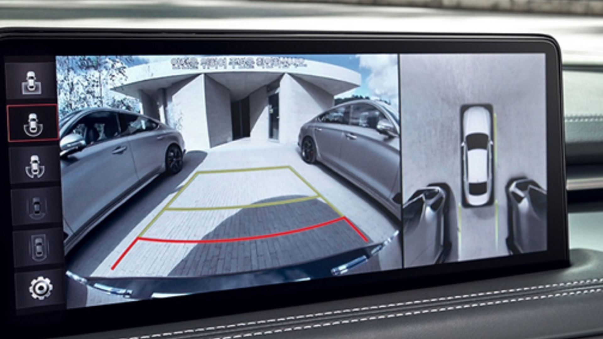 Rearview camera display of the Genesis G70 showing parking guidelines and surrounding views.