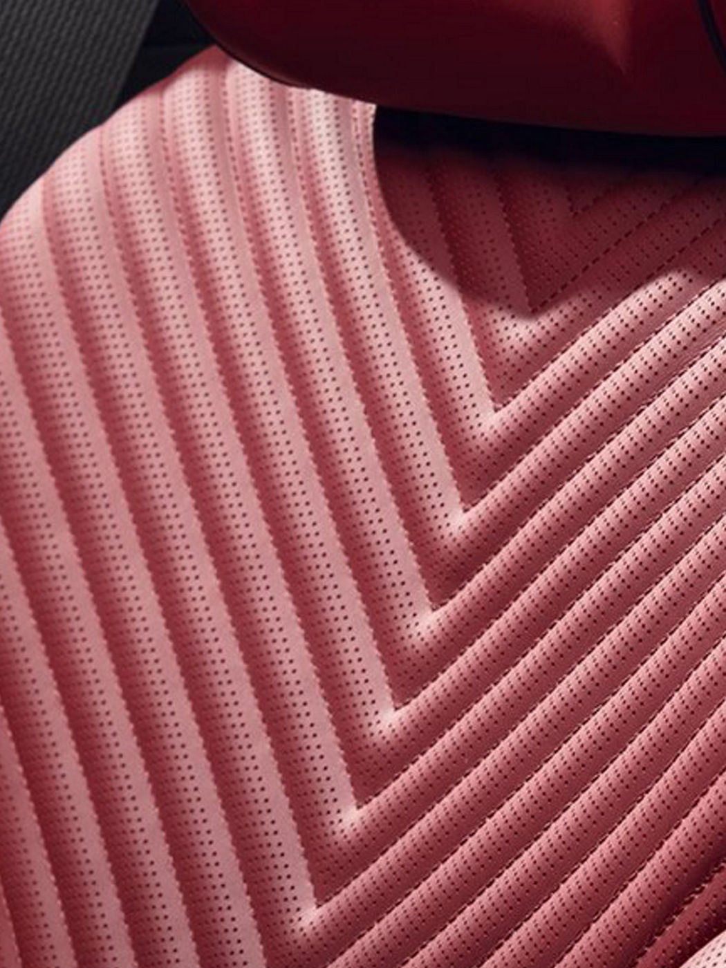 A close-up of the G80's red seat detail, highlighting its unique pattern and luxurious feel.