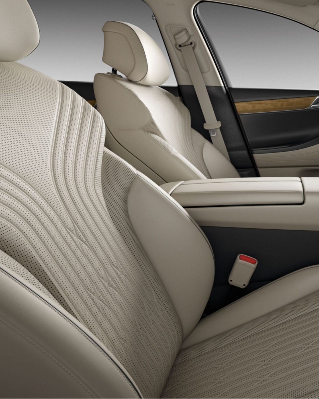 The rear seat space of the G80 with light beige leather upholstery, offering comfort and sophistication.