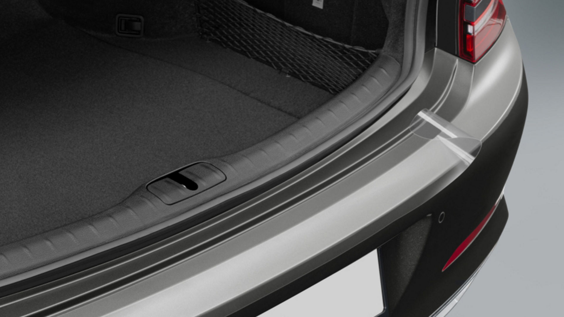 Close-up of the trunk edge, highlighting the sleek trim and functional design.