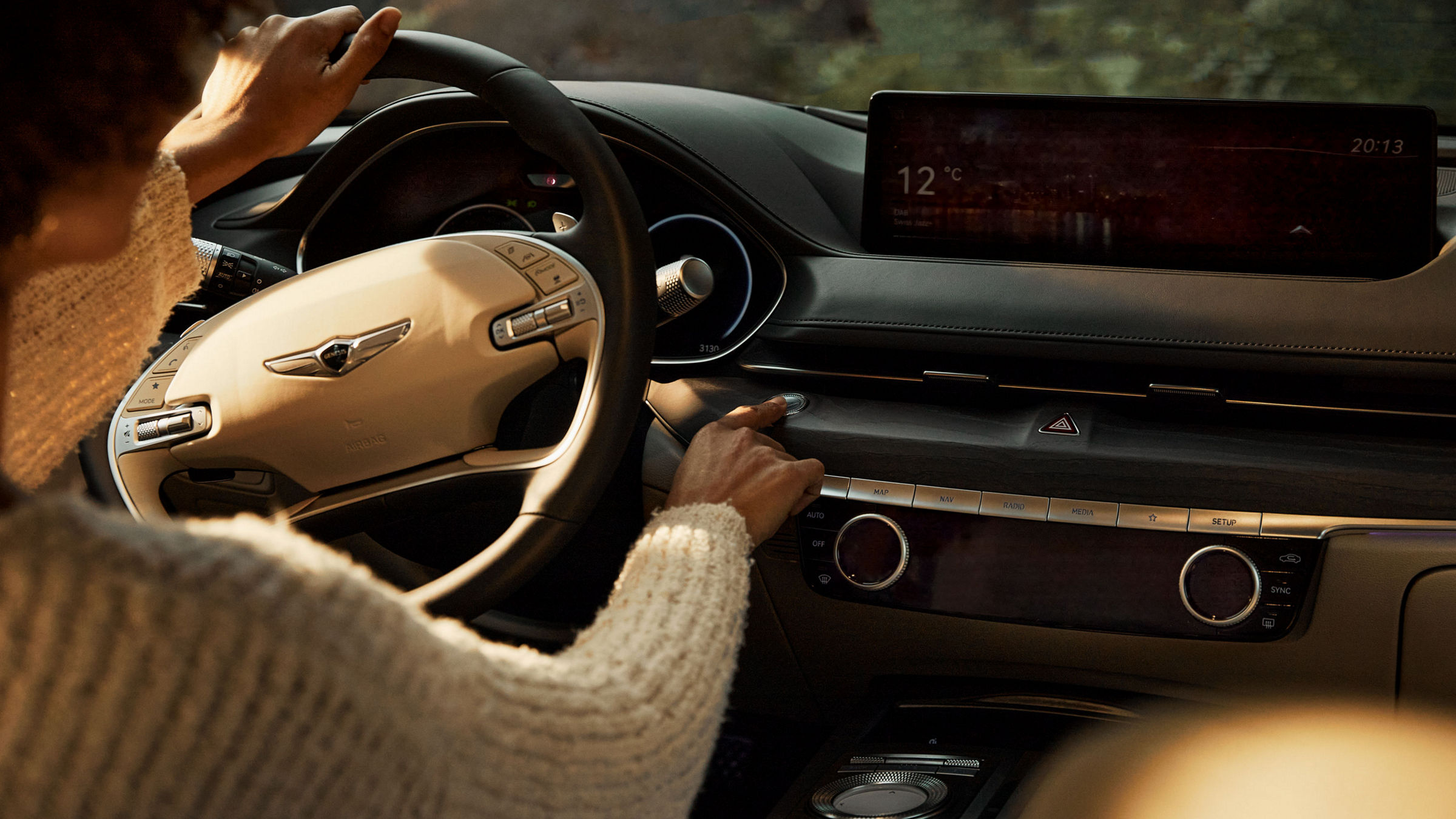 Looking over the shoulder of a person at the wheel of a car