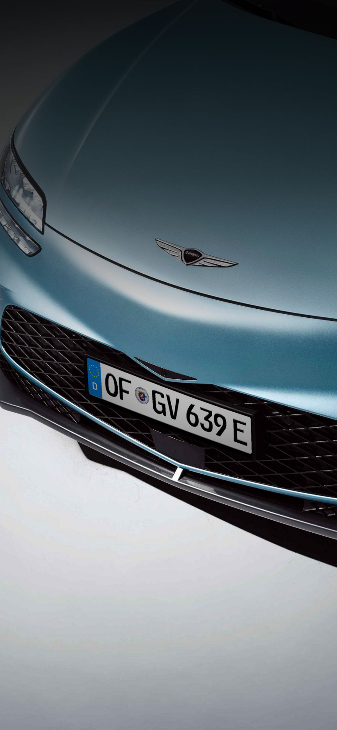 A close-up front view of a blue GV60.