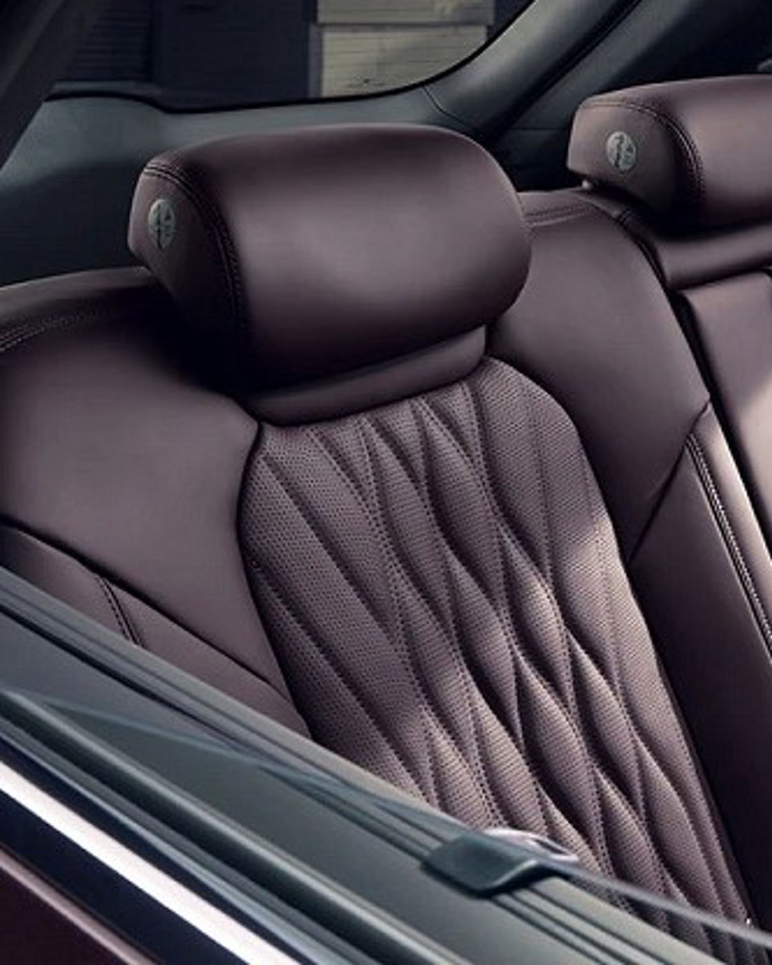 Rear seats of a car in dark red color