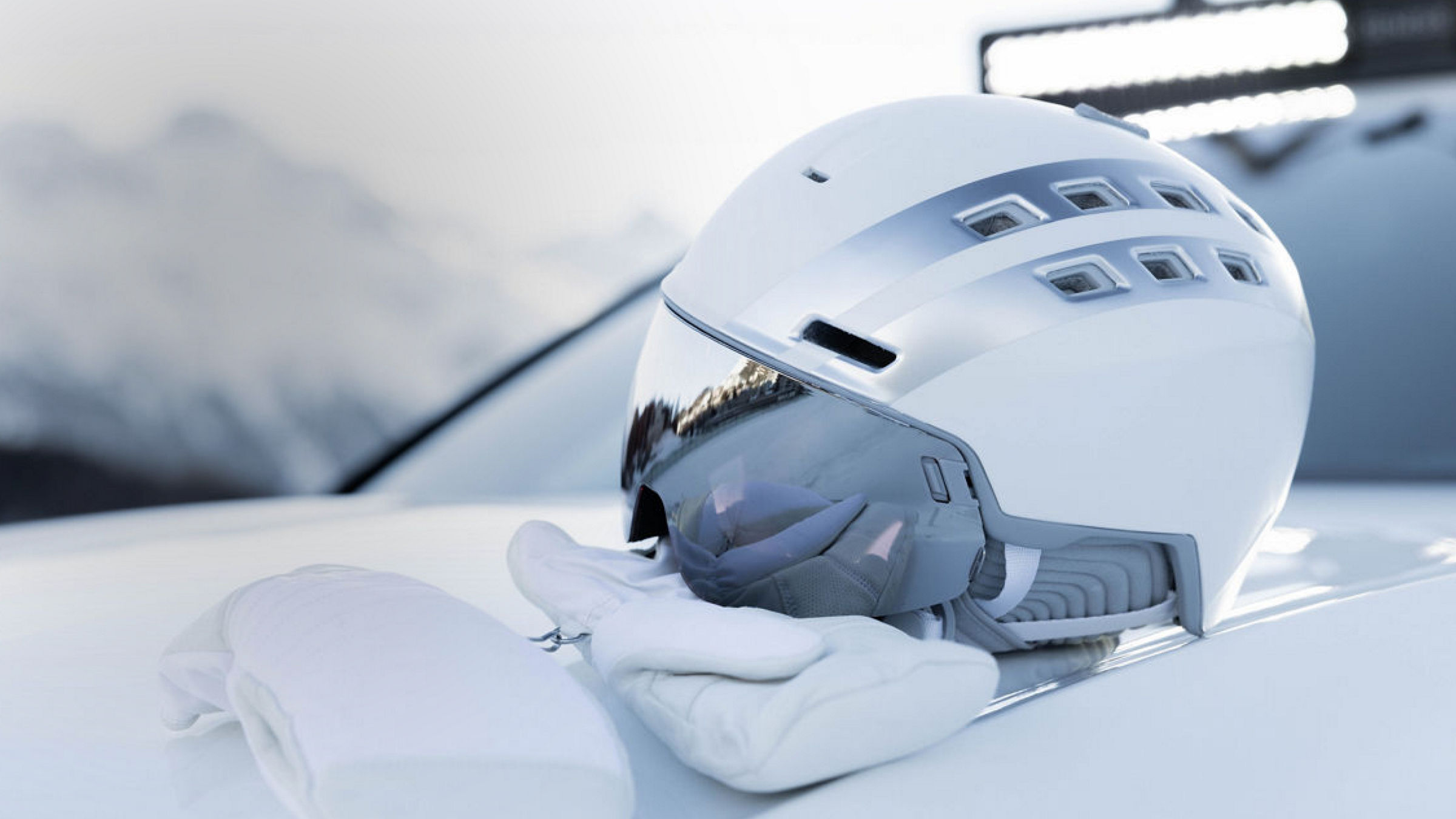 White helmet and gloves on a white bonnet