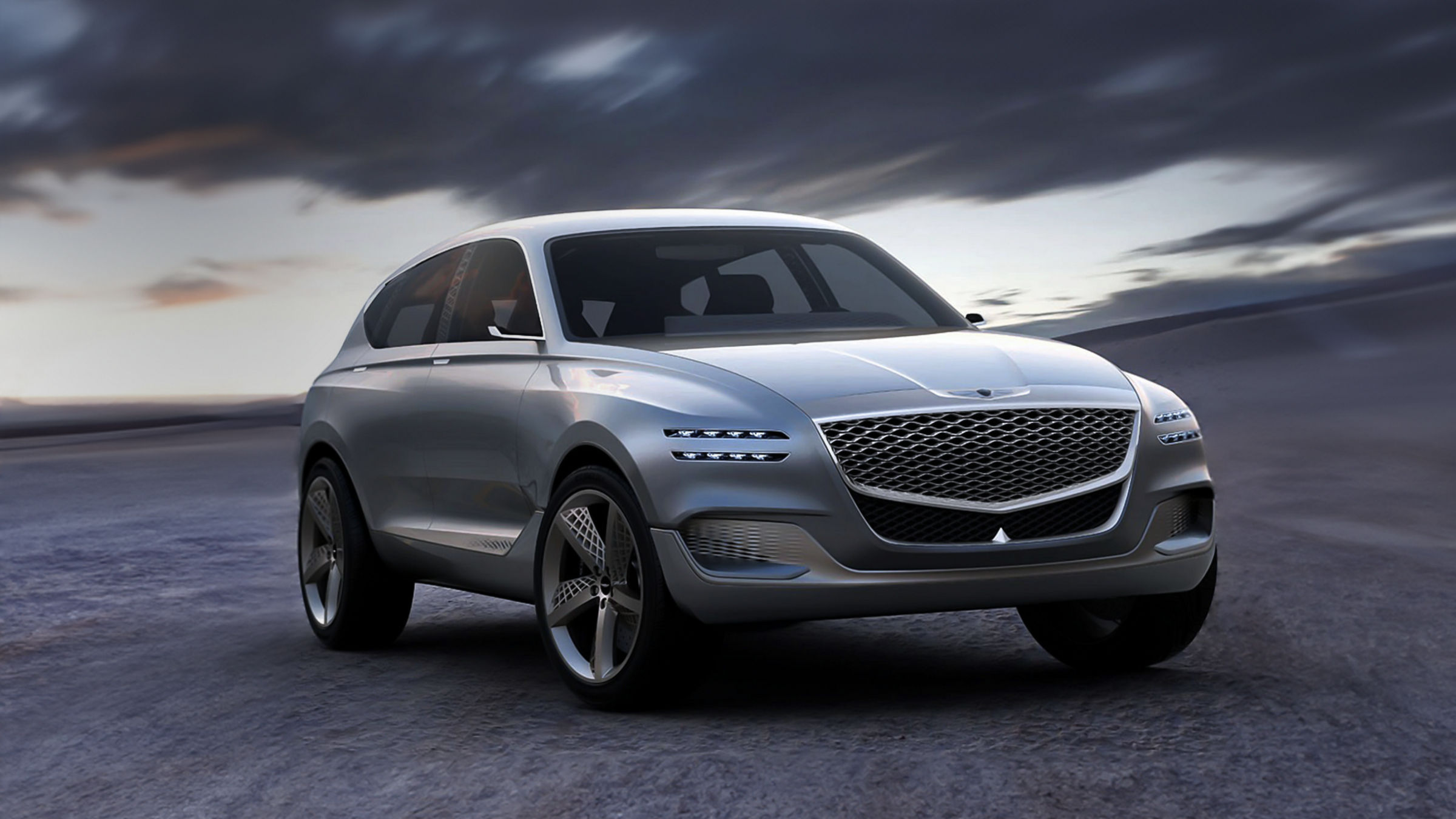 Genesis GV80 Concept SUV, front-side view under a dramatic sky