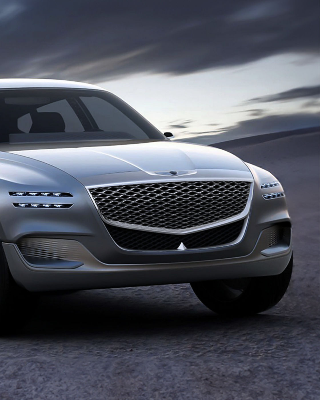 Front view of the Genesis GV80 Concept showcasing its signature grille and sleek headlights.