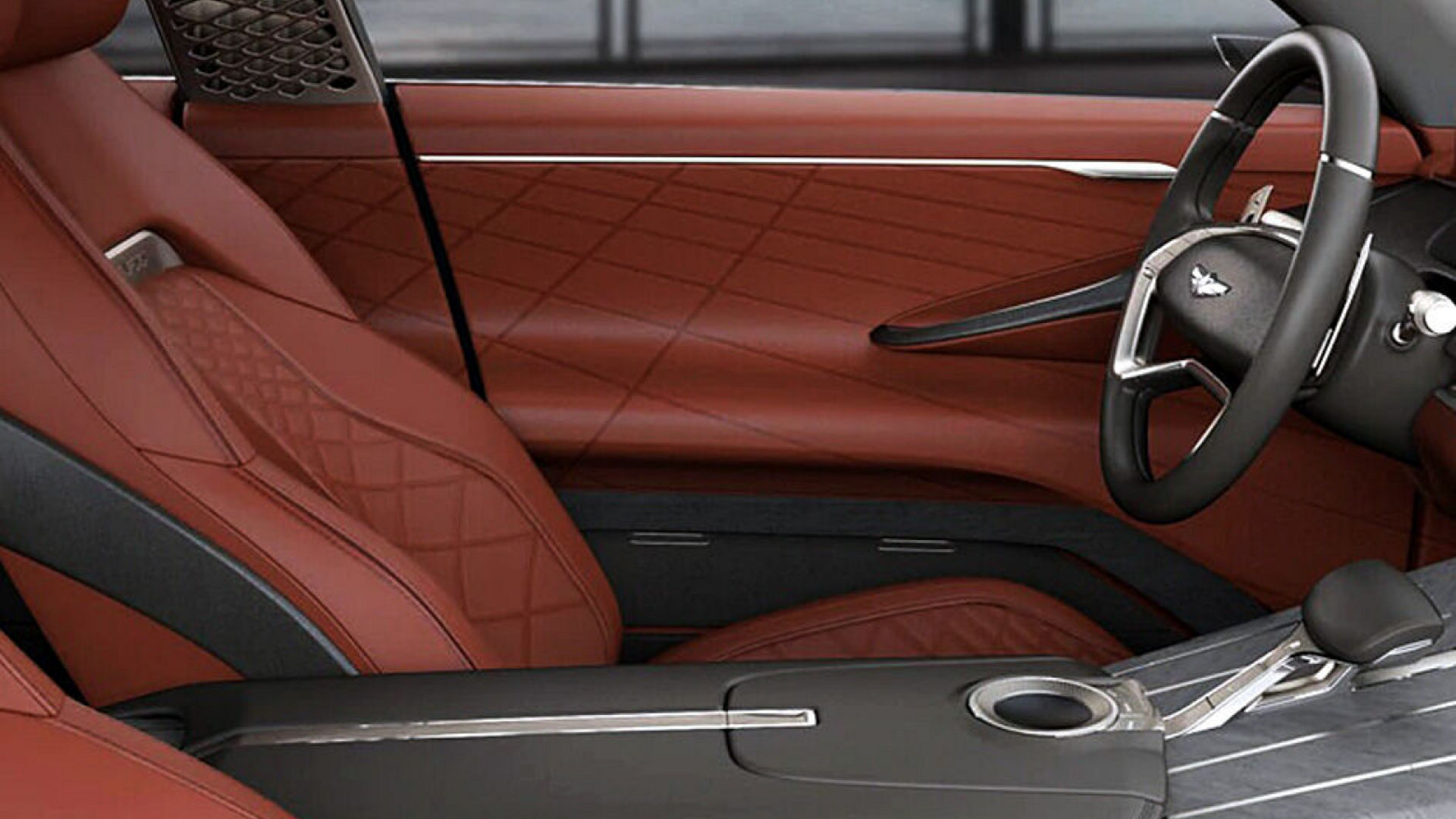 Luxurious interior of the Genesis GV80 Concept with quilted red leather seats and a sleek steering wheel