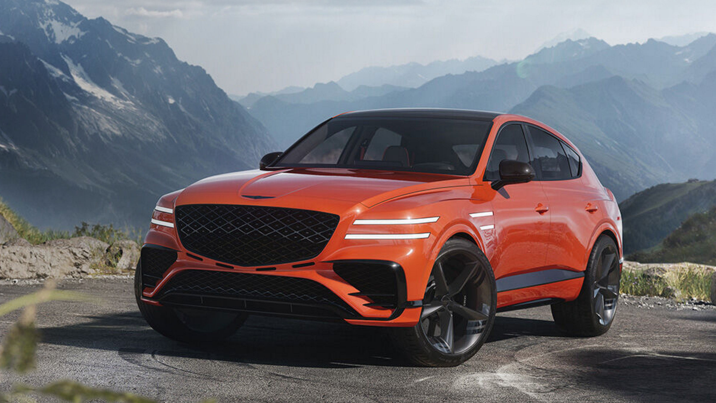 Genesis GV80 Coupe from the front with mountains in the background