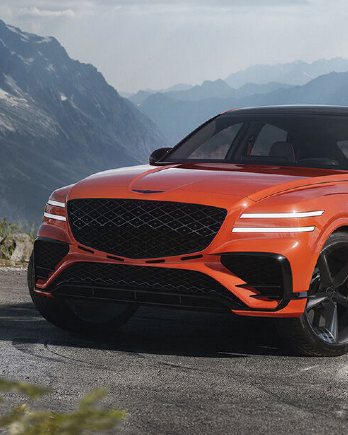 Genesis GV80 Coupe from the front with mountains in the background