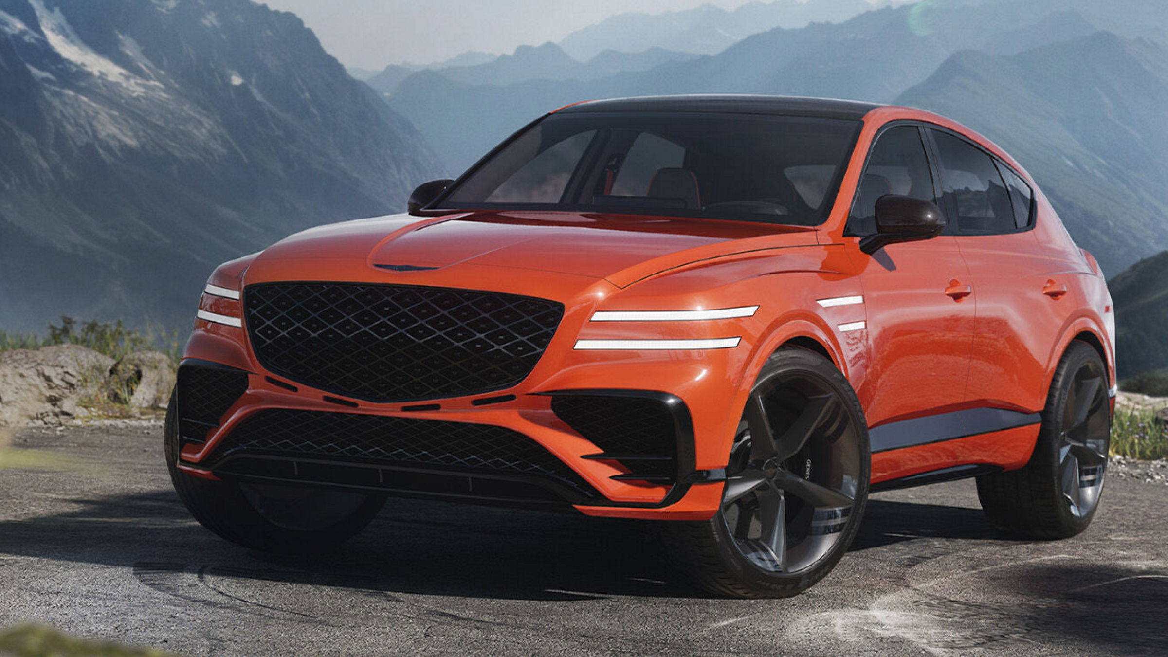 Genesis GV80 Coupe from the front with mountains in the background