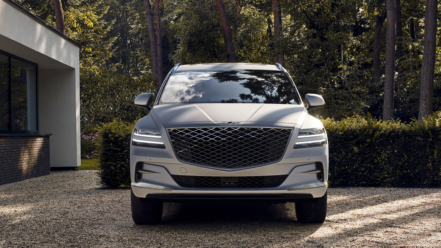 A close-up shot of the front grille and headlights of a GV80 vehicle.