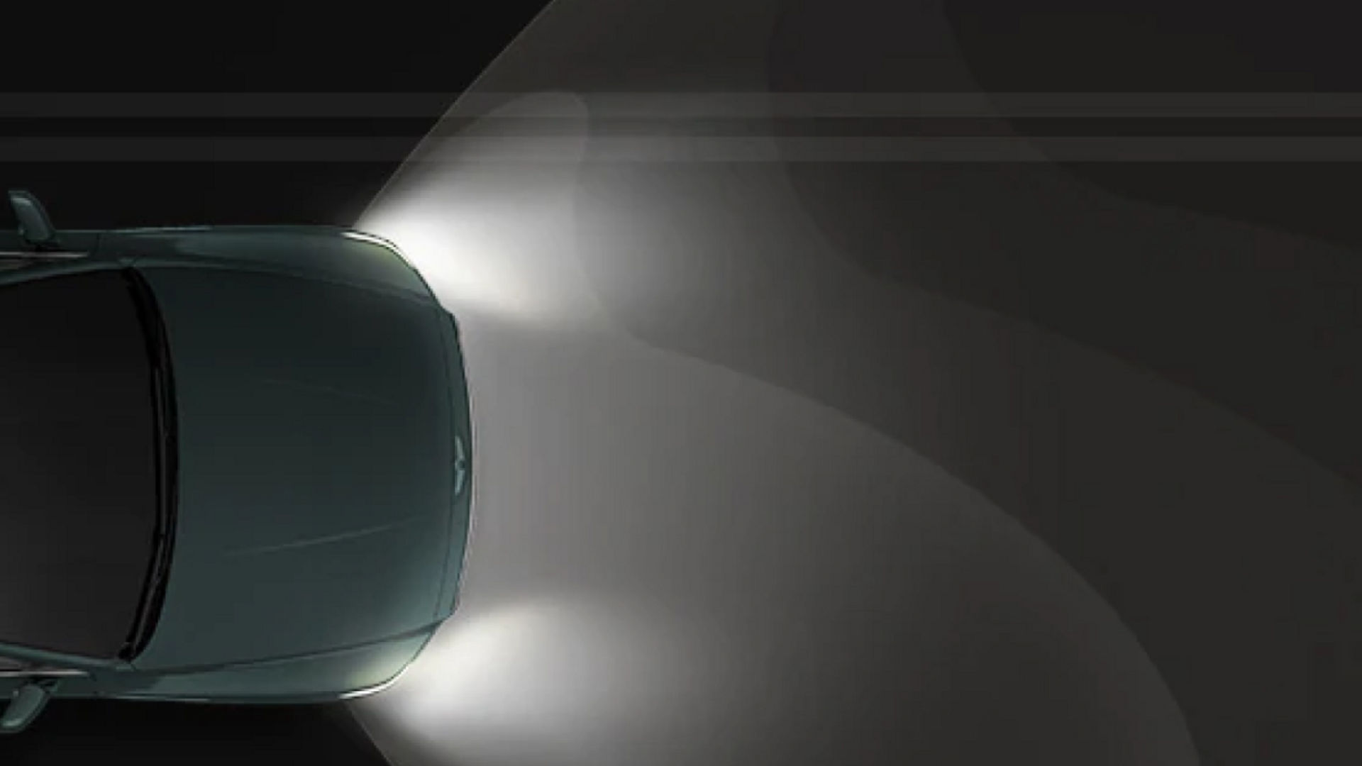 Overhead view of the Genesis GV80 using adaptive headlights, illuminating a dark road for improved visibility.