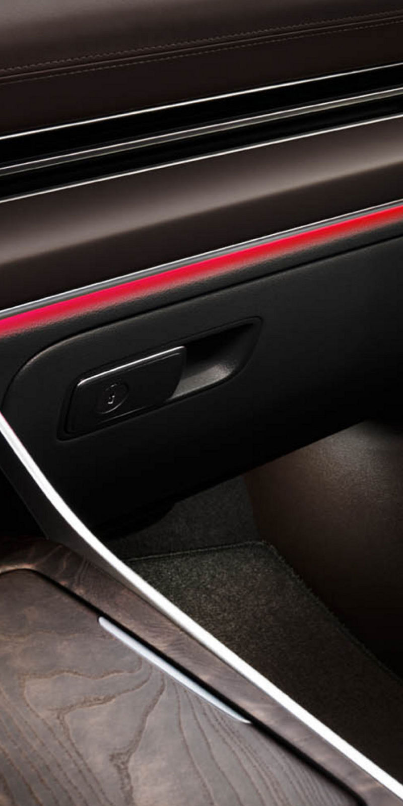 Interior view of the Genesis GV80 featuring beige quilted leather seats, a wide center console, and a modern dashboard with a digital display.