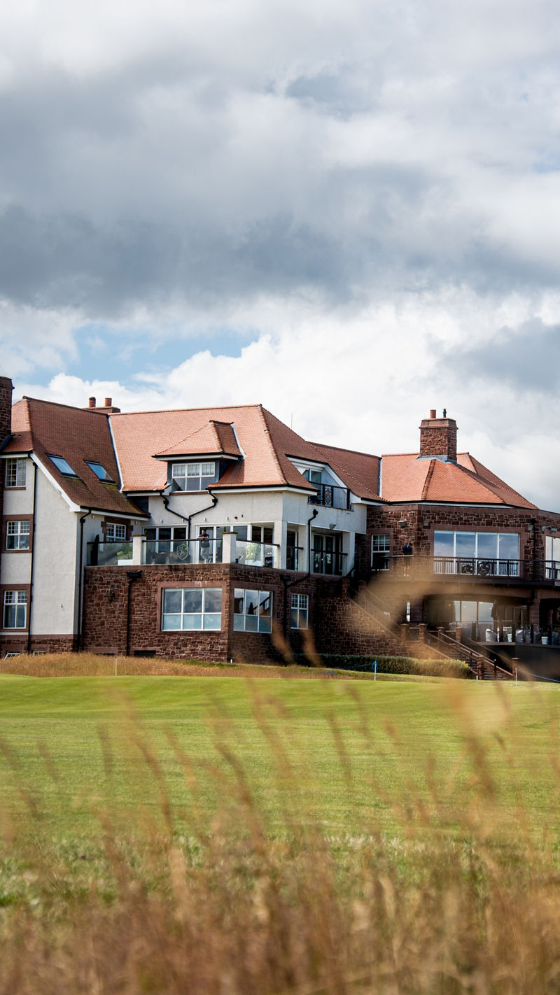 Large house next to a golf course